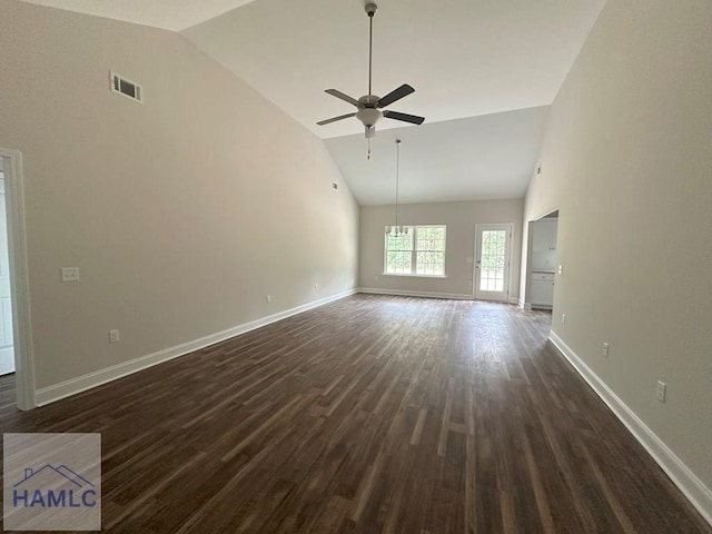 unfurnished living room with dark hardwood / wood-style floors, ceiling fan, and high vaulted ceiling