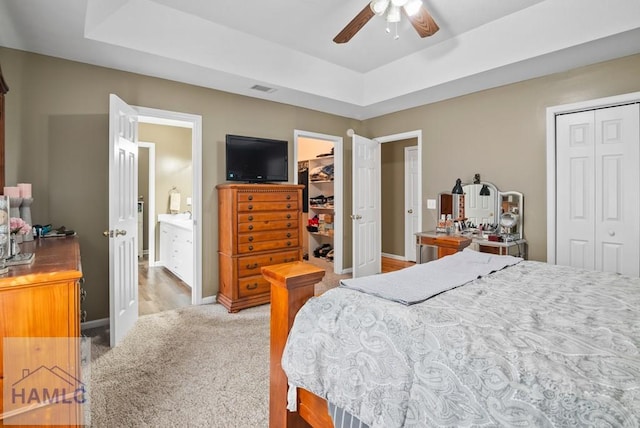 96 Palm Tree Pl, Jesup, GA 31545 - bedroom with a tray ceiling, a closet, light colored carpet, and a ceiling fan