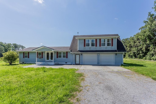 view of front of home featuring a garage, a front yard, and french doors