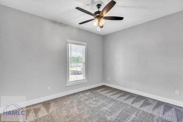 carpeted empty room with baseboards and a ceiling fan