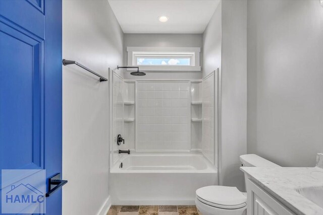 full bath featuring toilet, baseboards, vanity, and shower / tub combination