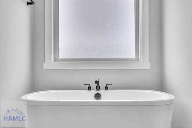 full bath with a soaking tub