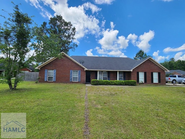 ranch-style home featuring brick siding