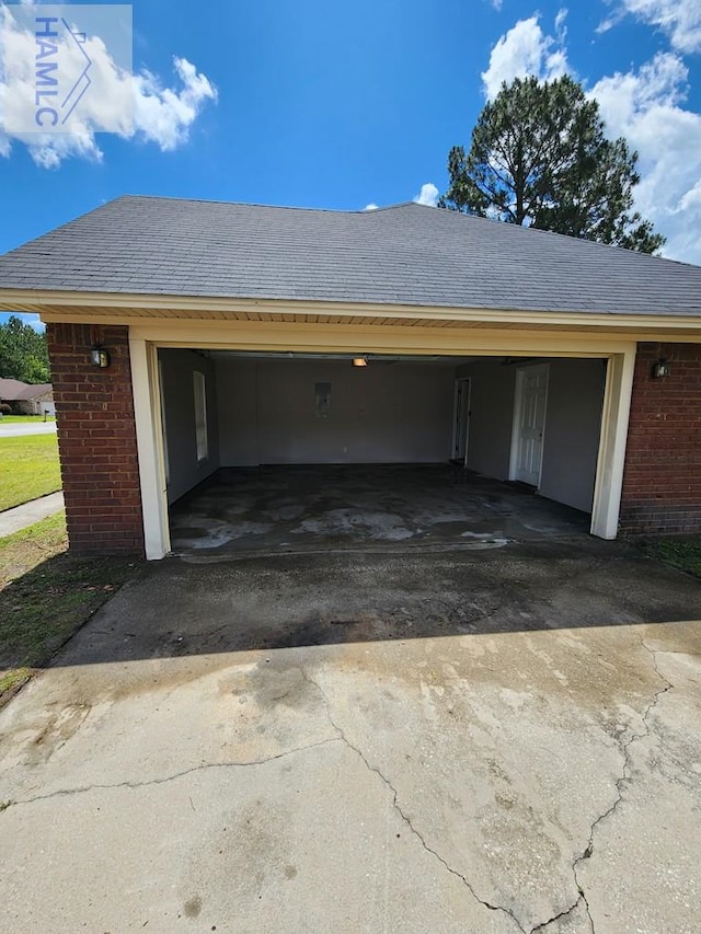 garage with asphalt driveway