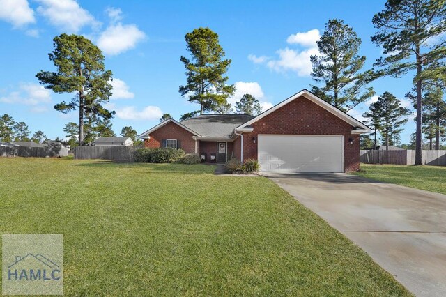 ranch-style house featuring a front yard and a garage