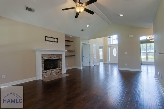 unfurnished living room with high vaulted ceiling, a ceiling fan, a stone fireplace, dark wood-style floors, and baseboards