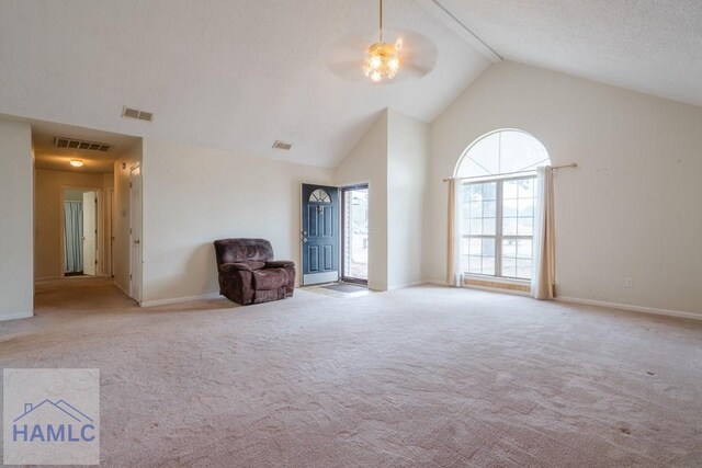 unfurnished room featuring ceiling fan, light carpet, and high vaulted ceiling