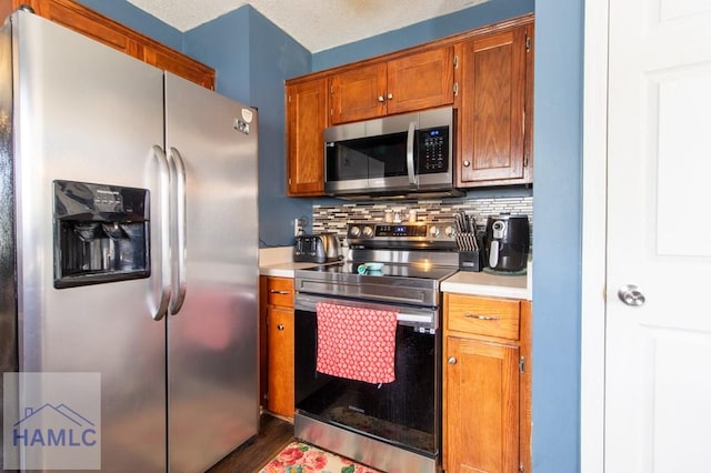 kitchen featuring tasteful backsplash and stainless steel appliances