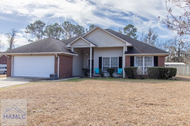 ranch-style house with a garage and a front yard