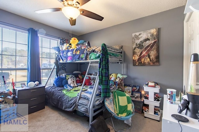 bedroom featuring light colored carpet and ceiling fan