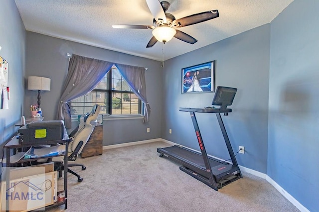 interior space with ceiling fan and a textured ceiling