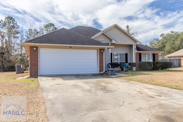 single story home featuring central AC, a garage, and a front yard