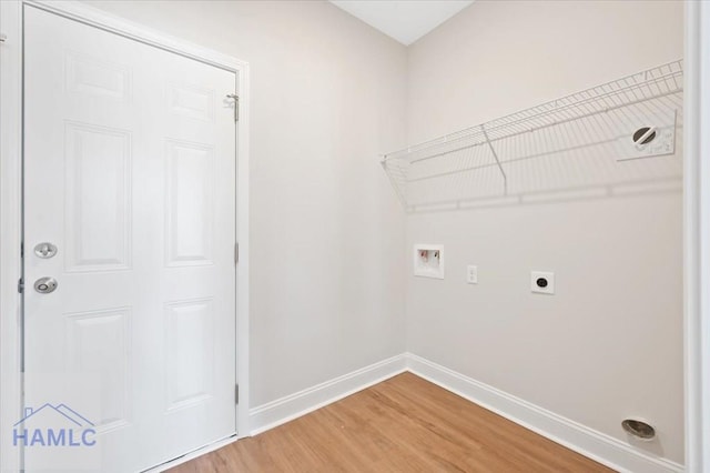 laundry room with hookup for a washing machine, baseboards, light wood finished floors, laundry area, and electric dryer hookup