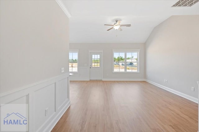 interior space featuring visible vents, lofted ceiling, a healthy amount of sunlight, and a ceiling fan