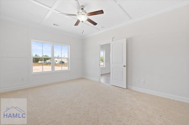 spare room with visible vents, baseboards, ornamental molding, light carpet, and coffered ceiling