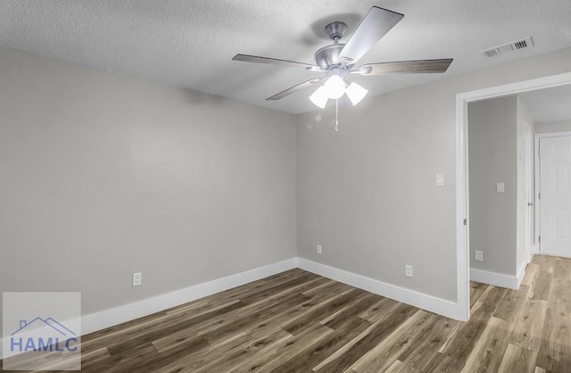123 2nd Ave, Midway, GA 31313 - spare room featuring a textured ceiling, wood finished floors, and ceiling fan