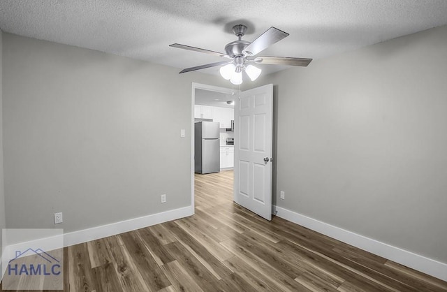 123 2nd Ave, Midway, GA 31313 - unfurnished room with wood finished floors, a textured ceiling, and ceiling fan