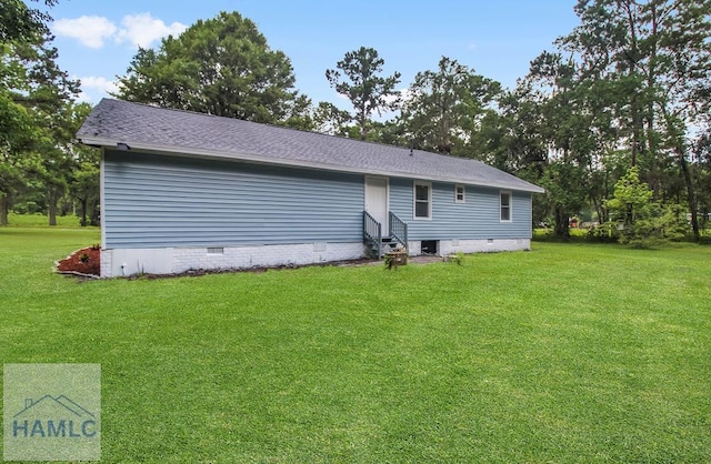 123 2nd Ave, Midway, GA 31313 - rear view of property with entry steps, crawl space, a lawn, and a shingled roof
