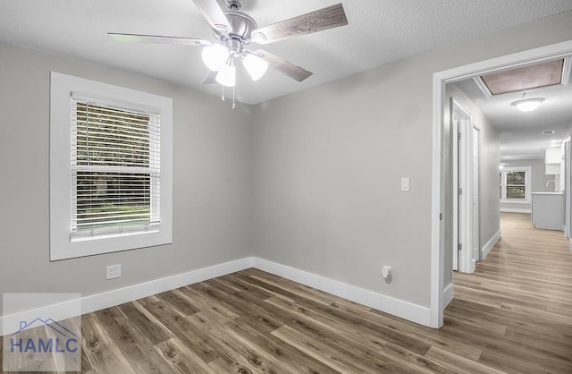 123 2nd Ave, Midway, GA 31313 - unfurnished room with attic access, wood finished floors, and ceiling fan