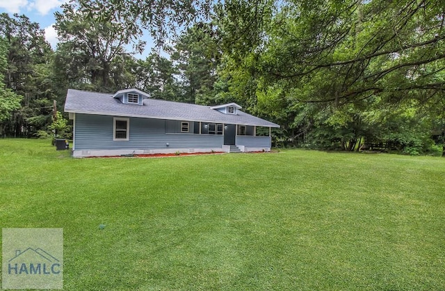 123 2nd Ave, Midway, GA 31313 - view of front of property featuring a front lawn, crawl space, a shingled roof, and view of wooded area