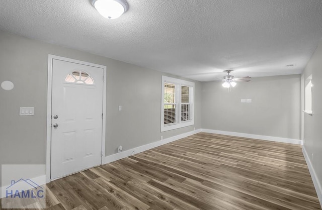 123 2nd Ave, Midway, GA 31313 - foyer with a textured ceiling, wood finished floors, and ceiling fan