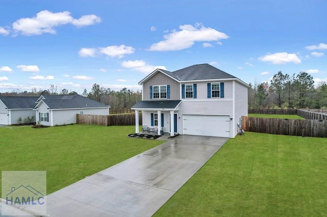 traditional-style house with driveway, a front lawn, a garage, and fence