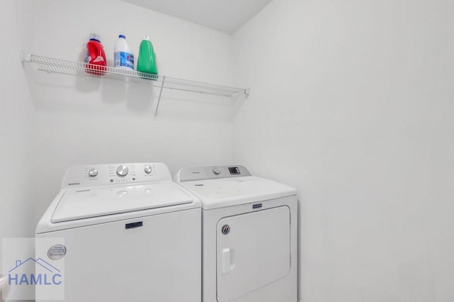 laundry room with laundry area and washing machine and dryer