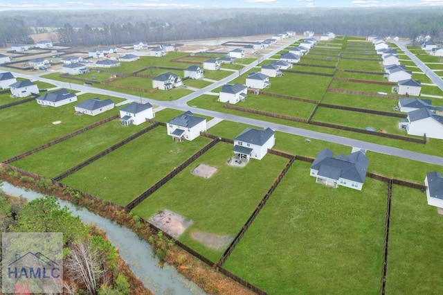 birds eye view of property with a residential view