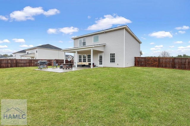 back of property with a patio area, a fenced backyard, and a yard