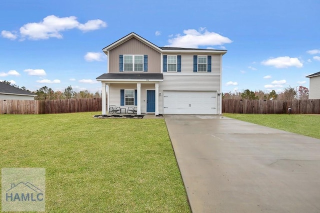 traditional home with concrete driveway, fence, a garage, and a front lawn