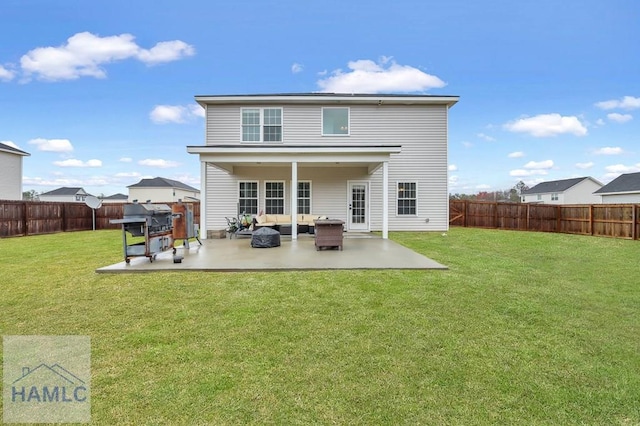 back of property with a patio area, a fenced backyard, and a yard