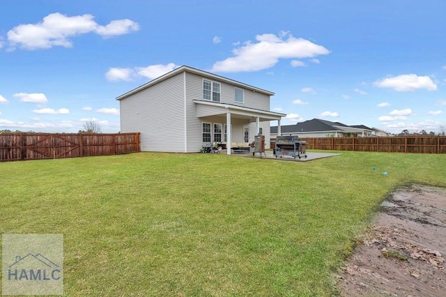 rear view of property with a patio, a lawn, and a fenced backyard