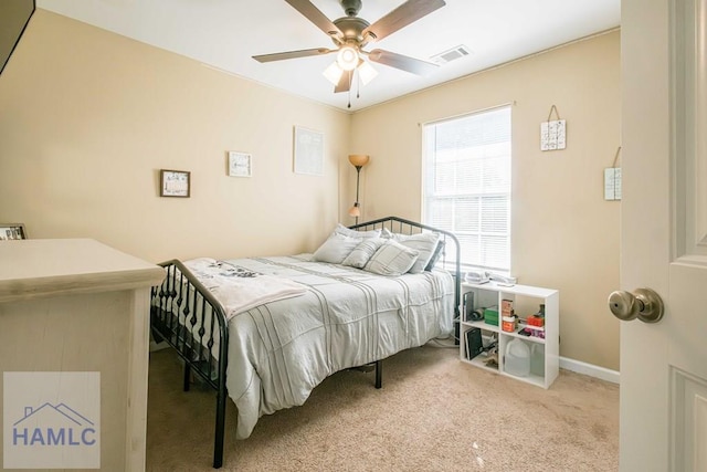 bedroom featuring ceiling fan and light colored carpet