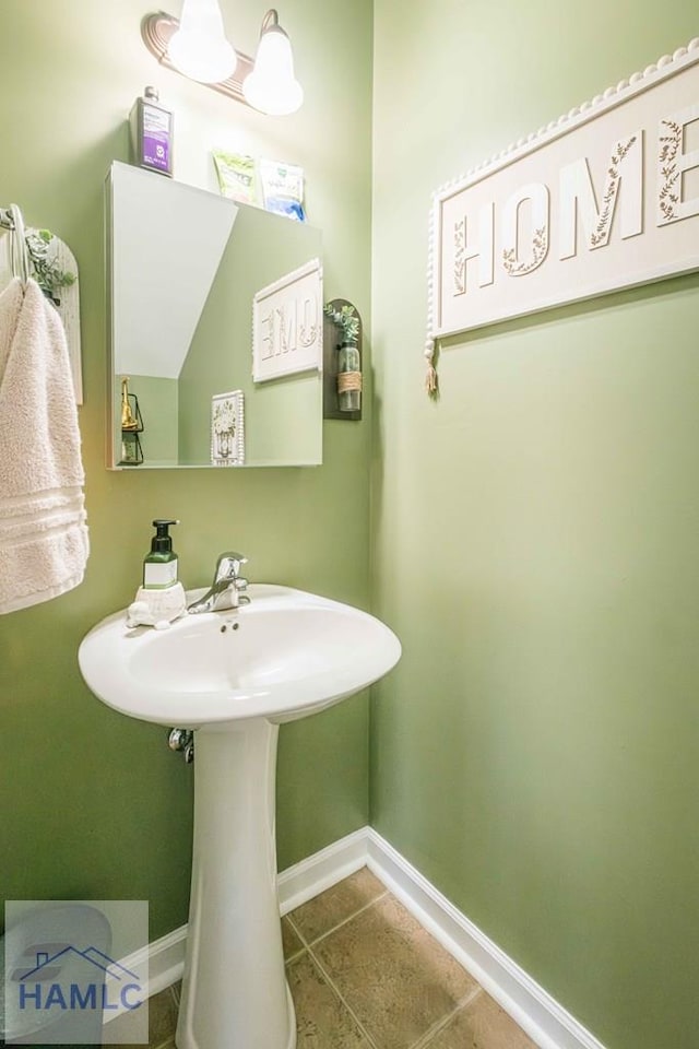 bathroom featuring tile patterned flooring and sink