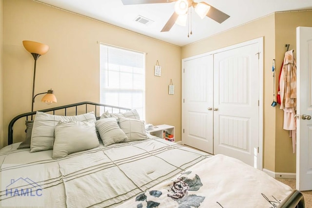 bedroom featuring carpet flooring, ceiling fan, and a closet