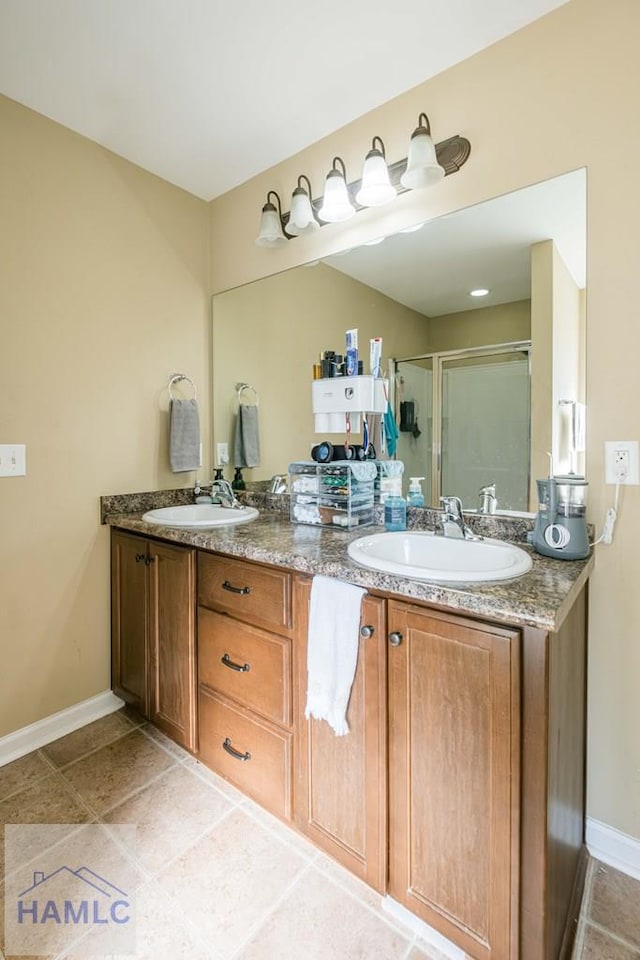 bathroom featuring vanity and an enclosed shower