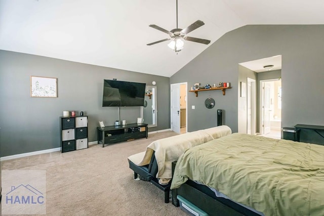 bedroom featuring carpet flooring, ceiling fan, ensuite bathroom, and vaulted ceiling