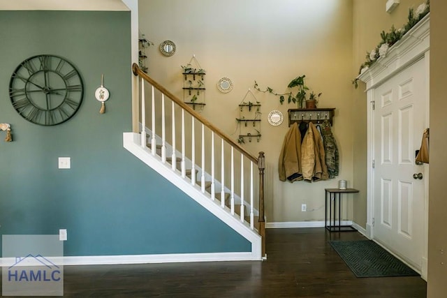 entryway with dark wood-type flooring