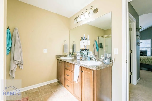 bathroom featuring vanity and an enclosed shower