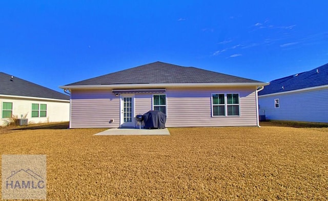 back of house with a patio and central AC