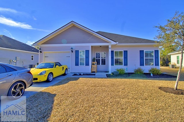 ranch-style home featuring a garage and cooling unit