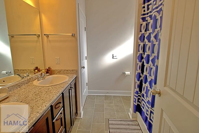 bathroom with tile patterned flooring and vanity