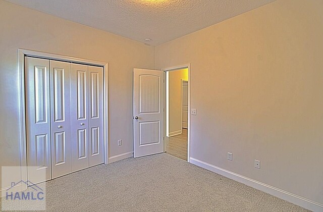 bathroom with a shower with shower curtain, hardwood / wood-style floors, vanity, and toilet