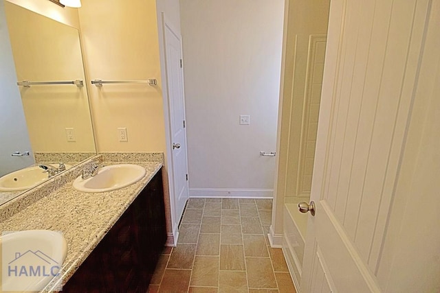 bathroom featuring vanity and a bathtub