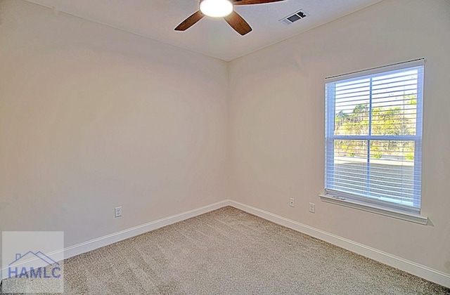 carpeted empty room with ceiling fan