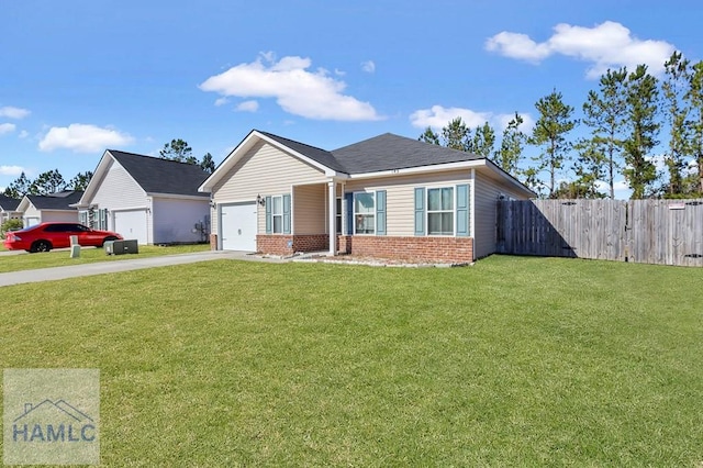 view of front of property with a garage and a front lawn