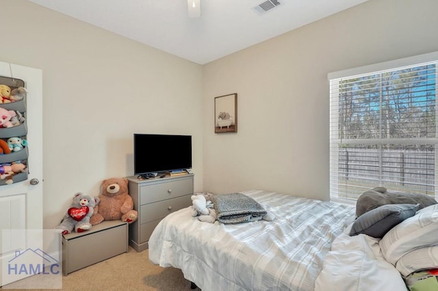 carpeted bedroom with ceiling fan