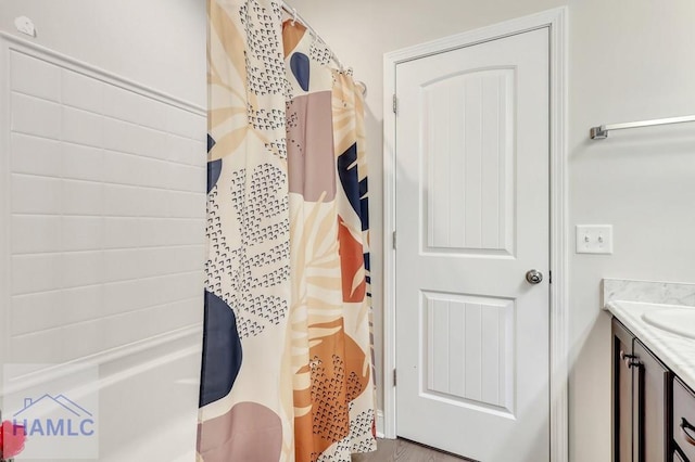 bathroom featuring vanity and wood-type flooring