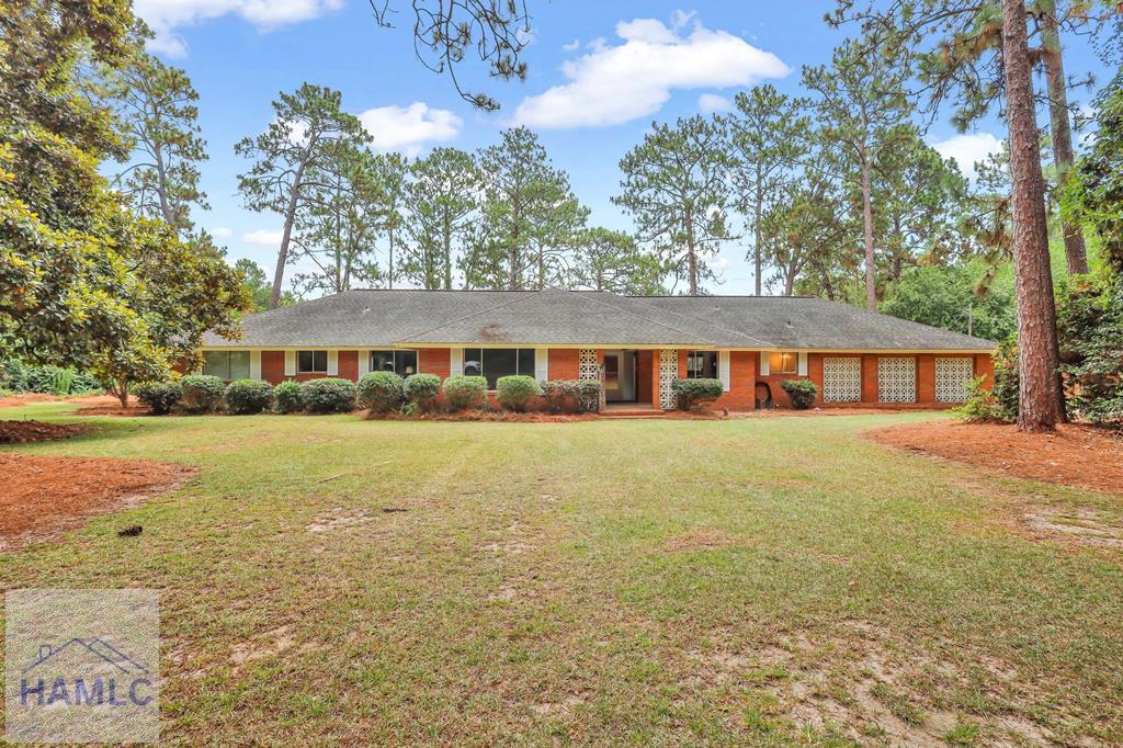 336 Bryant Boyette Rd, Bristol, GA 31518 - ranch-style home featuring a front lawn