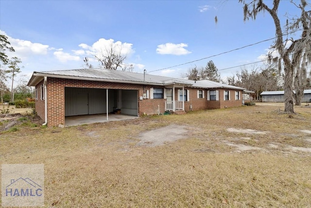 back of property with a carport